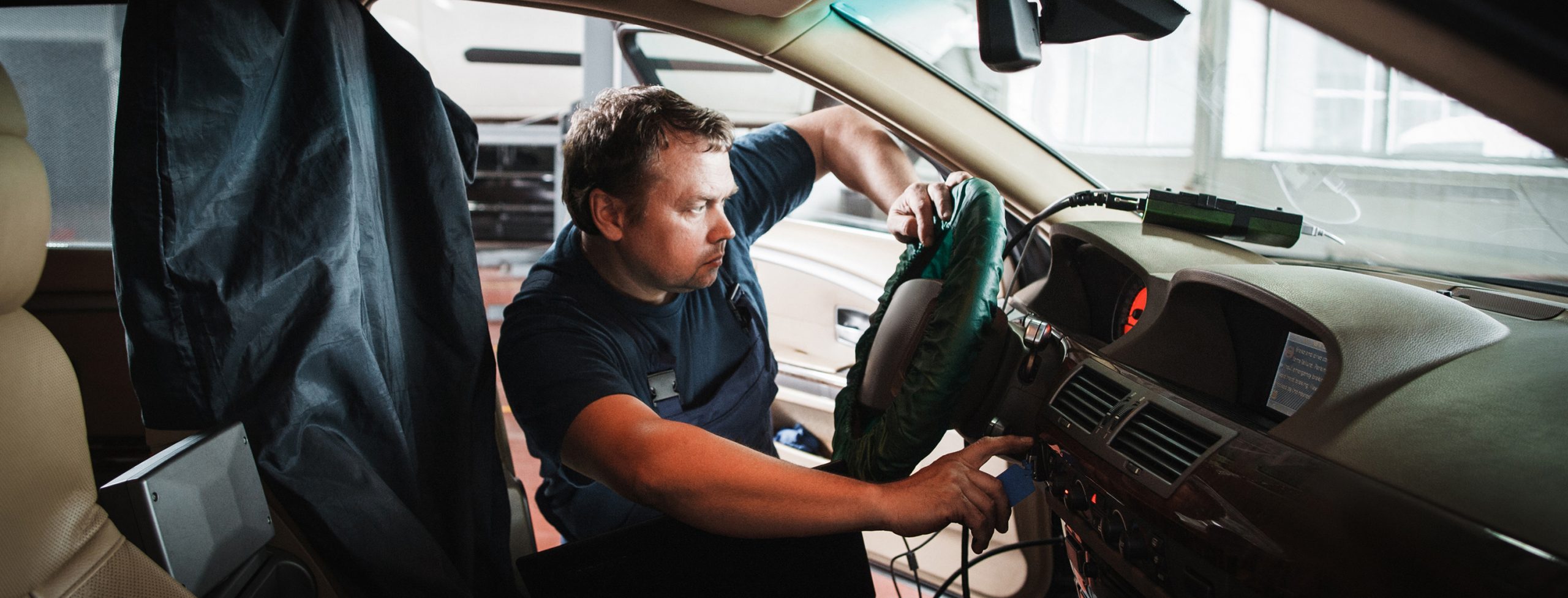 On-board computer tuning by serviceman at garage